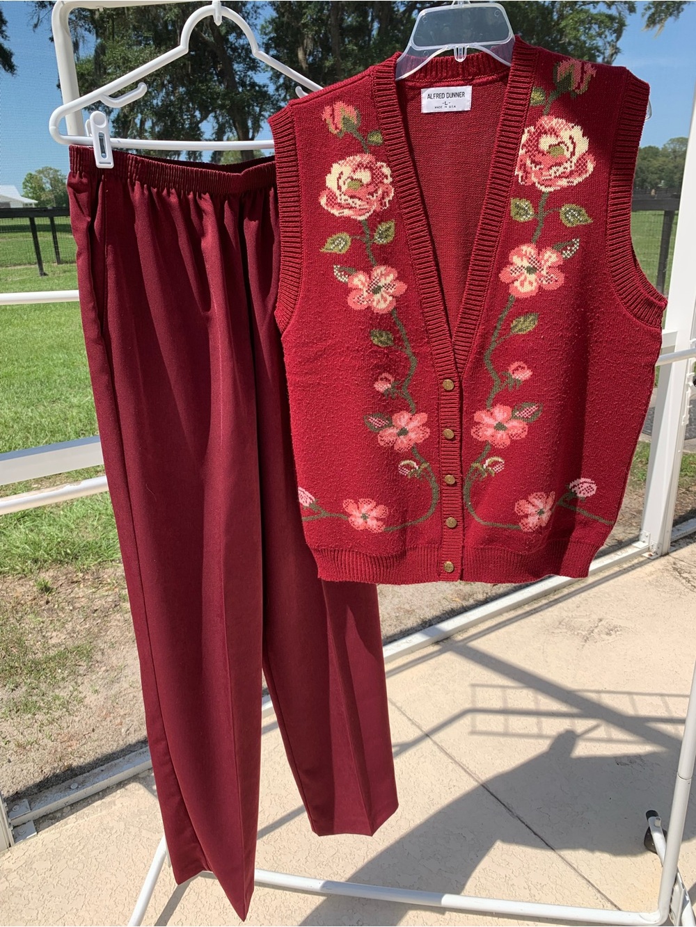Alfred Dunner sweater vest in Rich Red with flowers.  Pants sold separately.